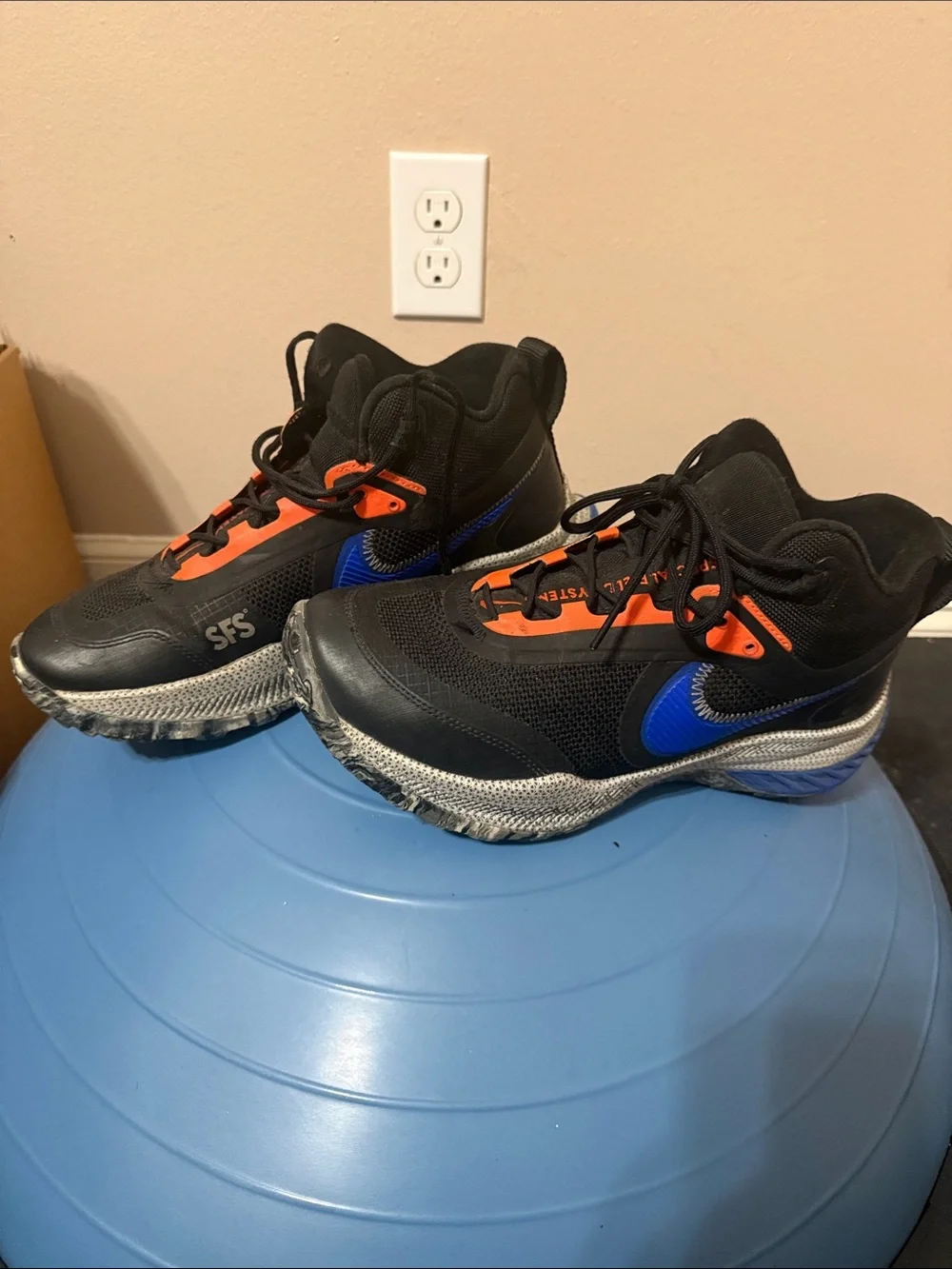 Nike Black Sneakers with Blue Swoosh and Orange Accents